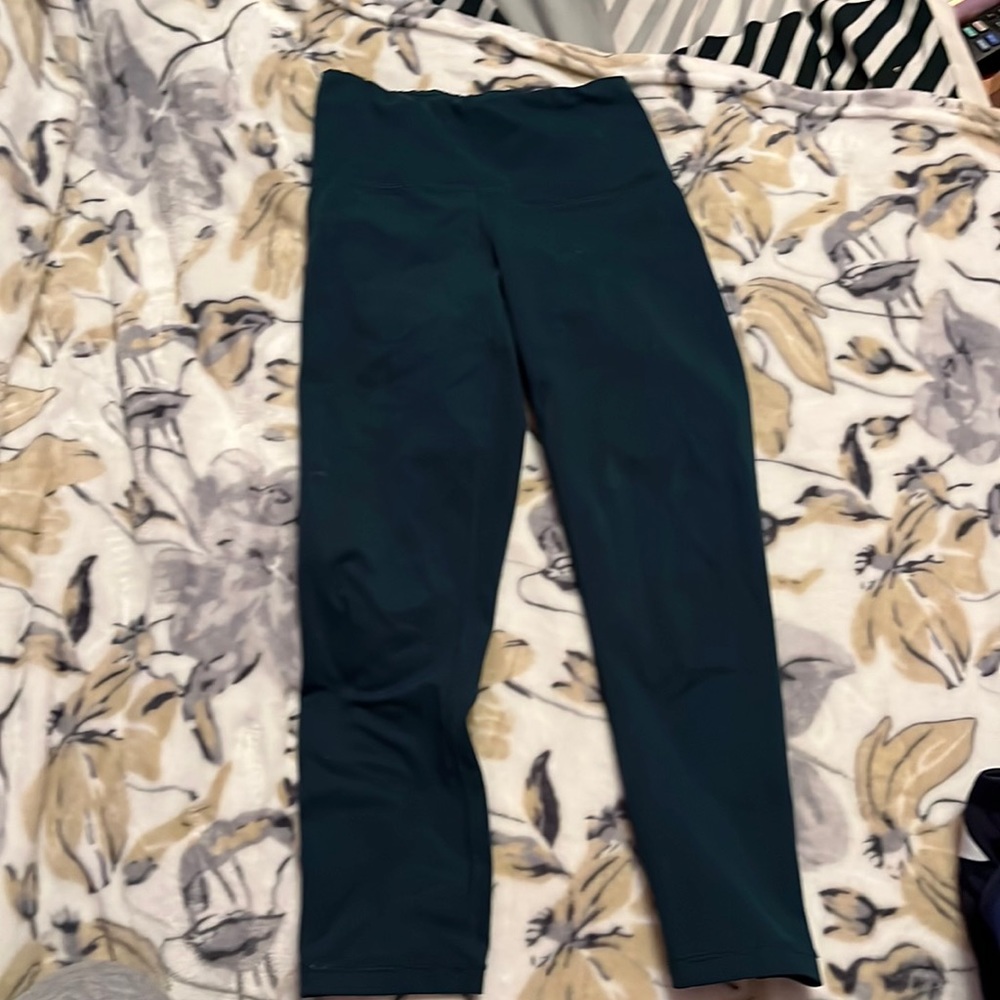 three random pairs of leggings i have. all are under a small.